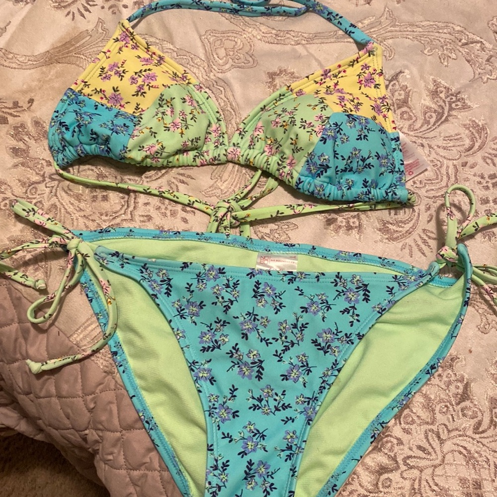 Green yellow and blue string bikini fits size 5-7 top and 3-5 bottom. Like new.